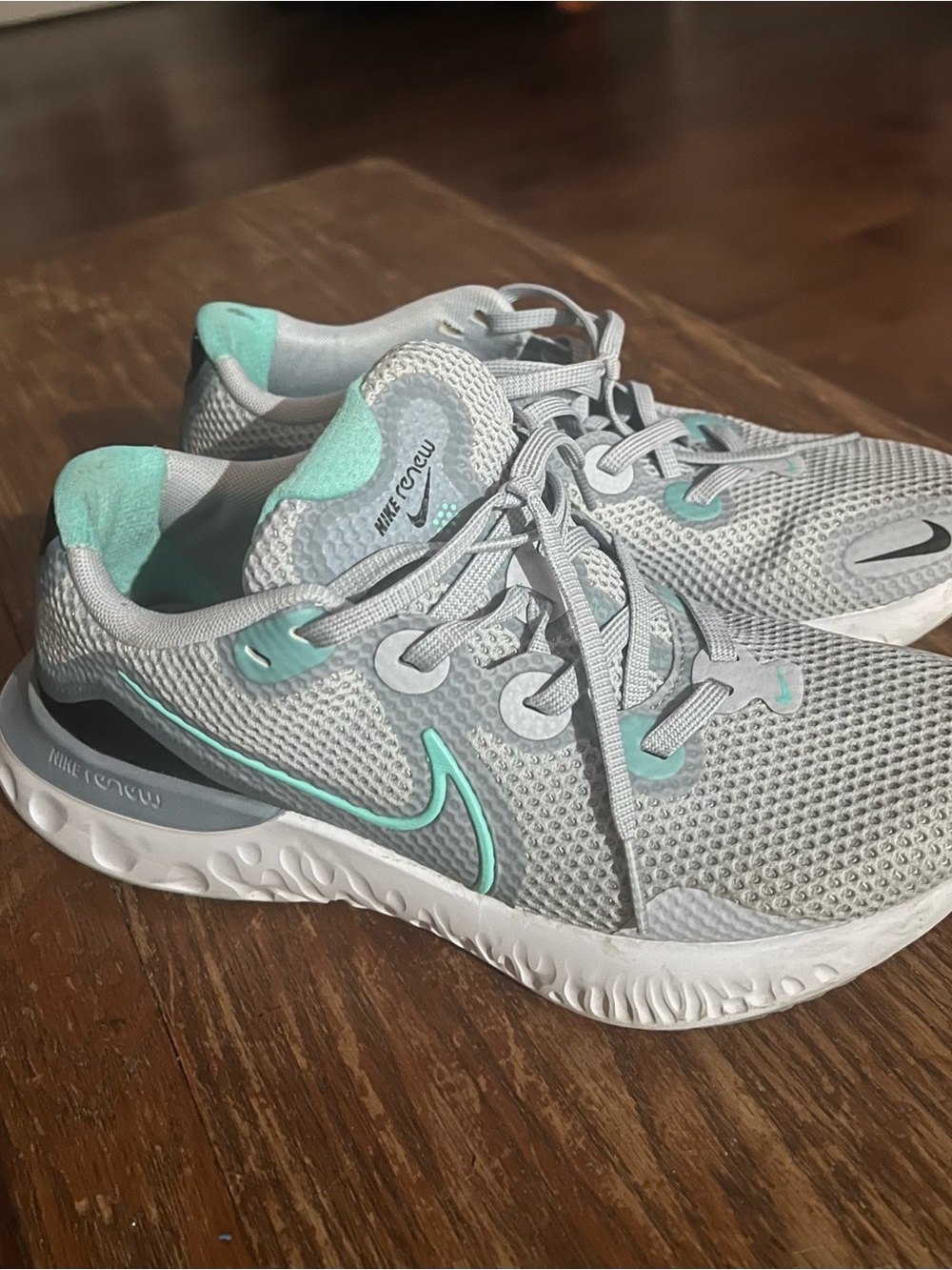 Nike Women’s Light Gray Running Shoes with Teal Accents